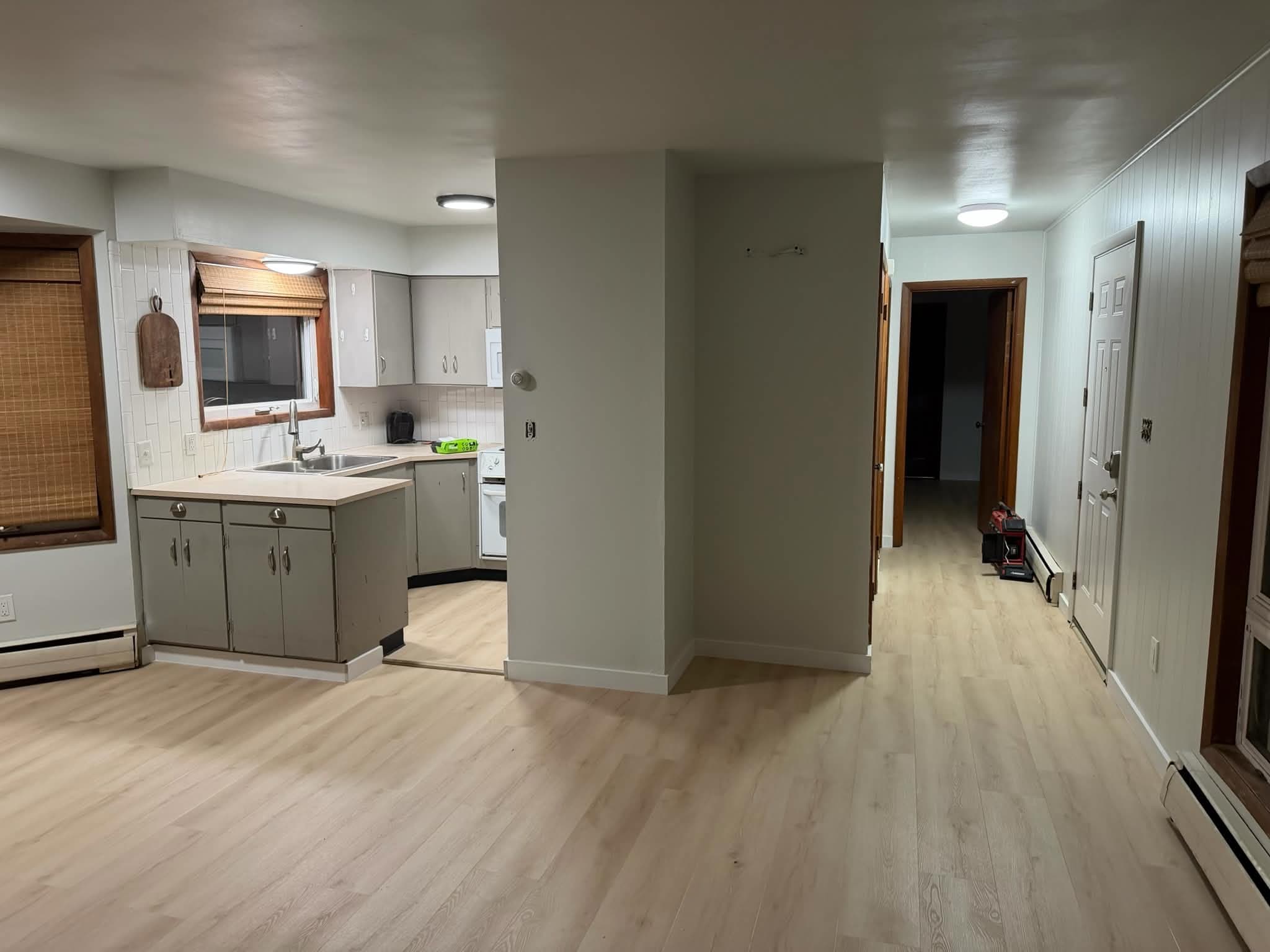 LVP flooring in open-concept kitchen and living area