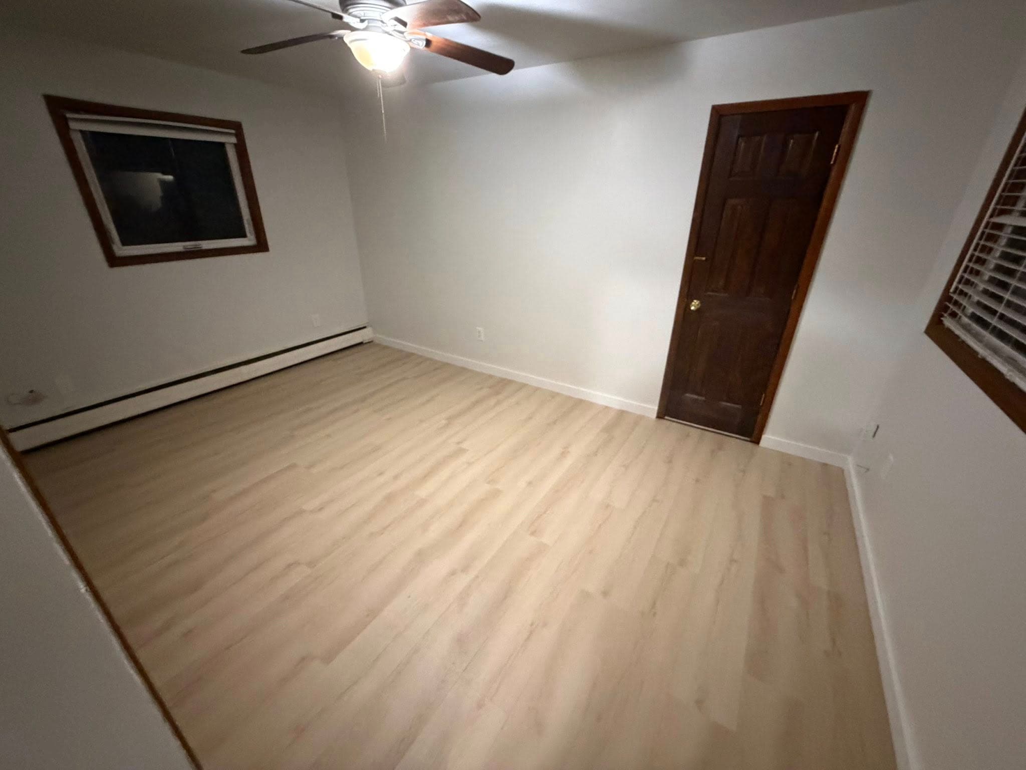 Bedroom refresh with new LVP flooring and ceiling fan by Sourdough Construction, Juneau Alaska